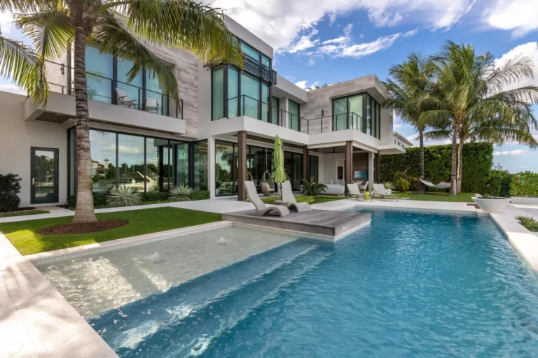 Long modern pool and spa at a waterfront villa in South Florida